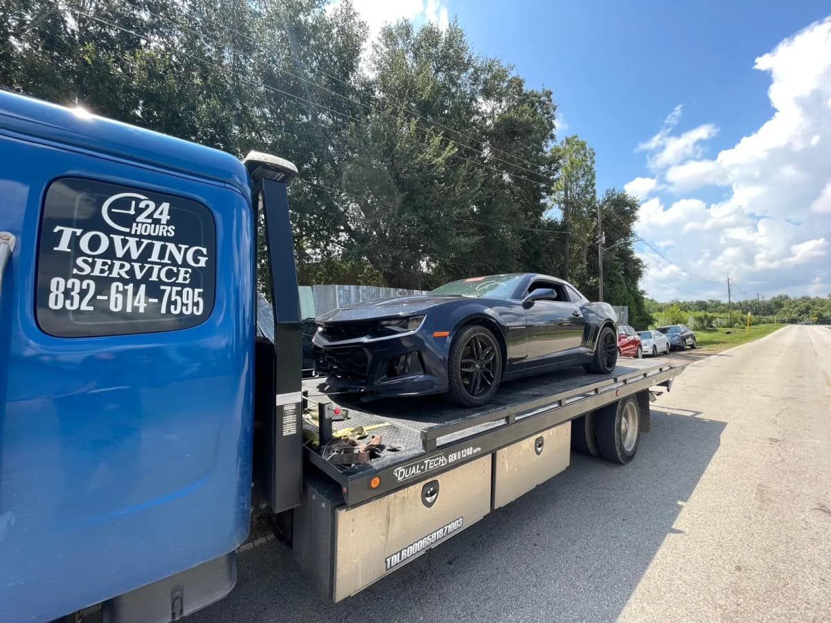 Collision damaged Camaro recovered for transport to a body shop in Houston TX