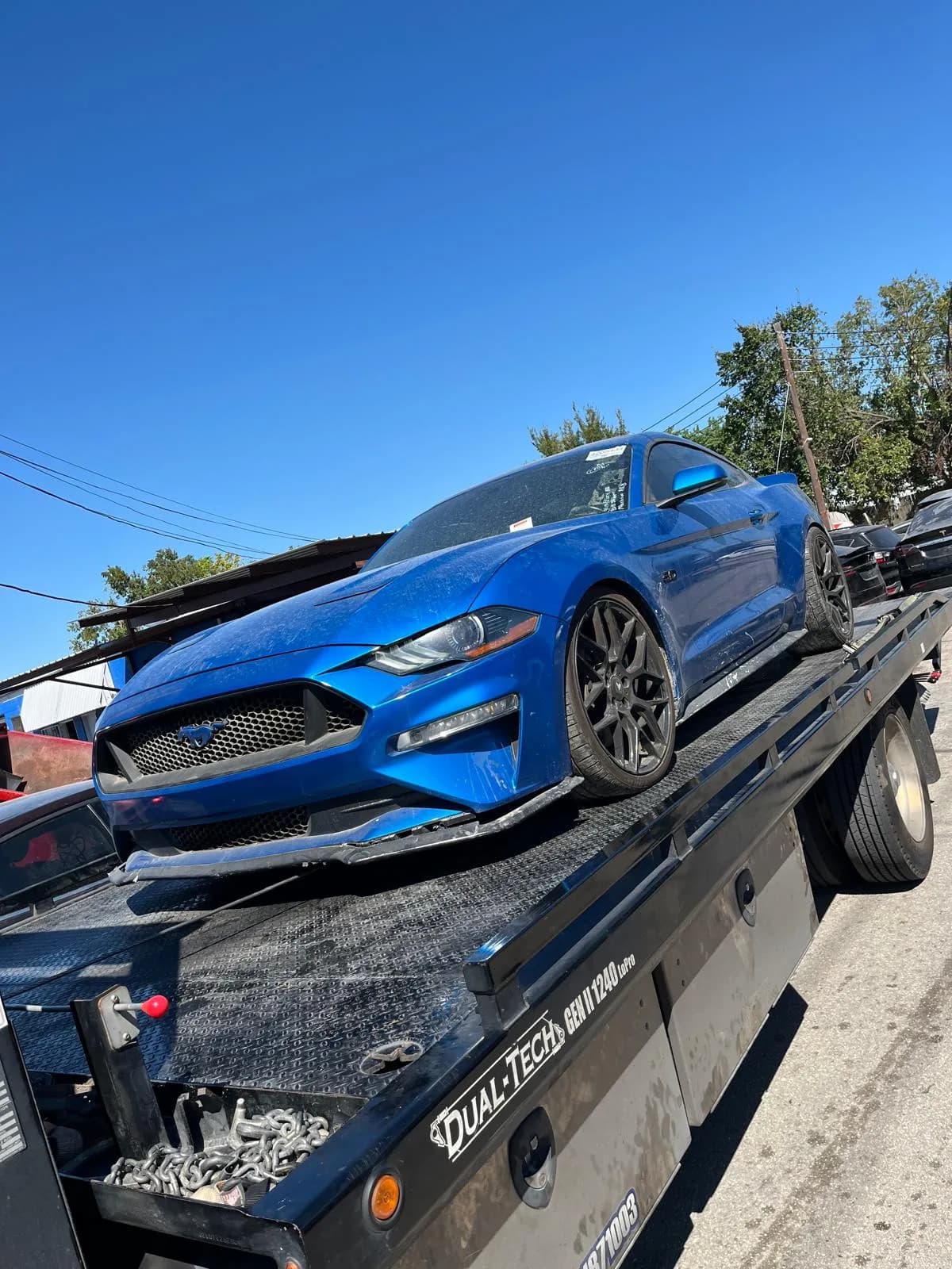 Ford Mustang accident recovery and transport to a body shop in Houston TX