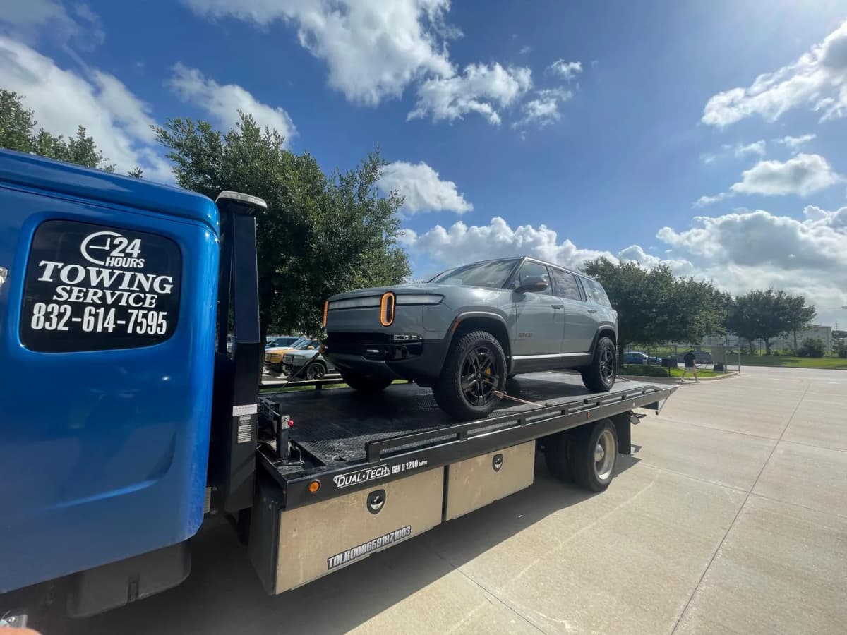 Electric Vehicle Towing - Rivian SUV Houston TX Rivian electric SUV on flatbed tow truck in Houston TX