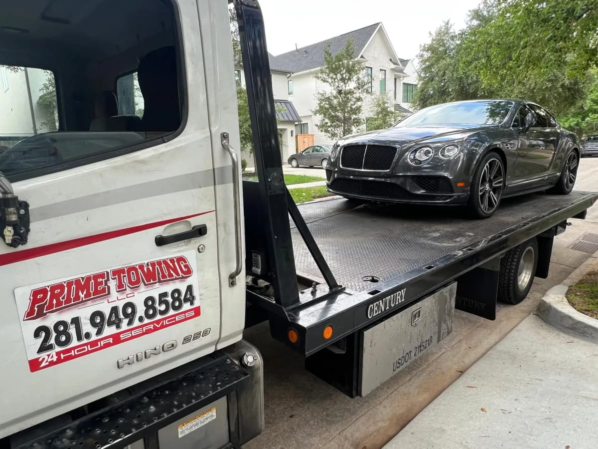 Bentley Continental Towing - Houston TX Bentley Continental GT on Prime Towing flatbed truck in Houston TX neighborhood