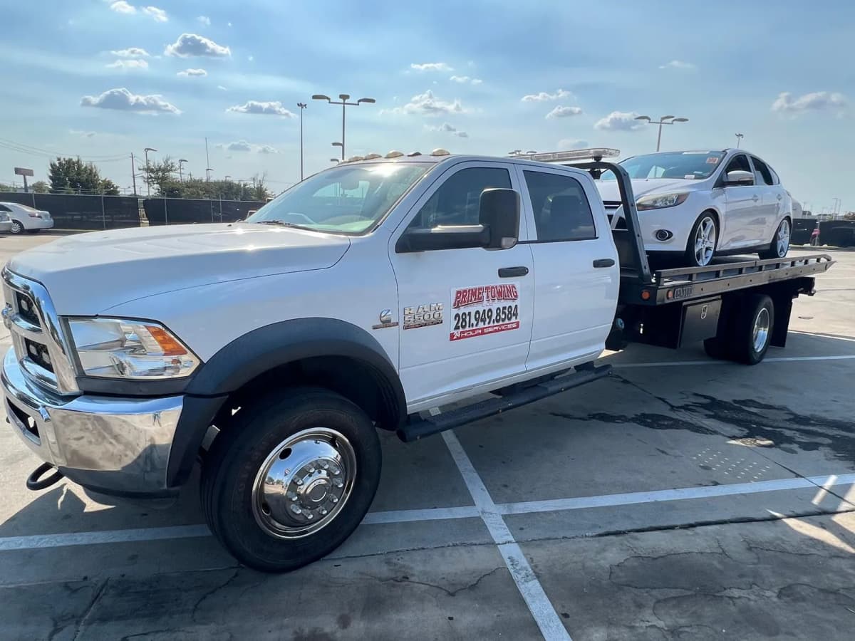 Towing to a Partner Repair Shop - Prime Towing LLC Houston TX Prime Towing LLC flatbed truck used to tow vehicles to a partner repair shop in Houston TX