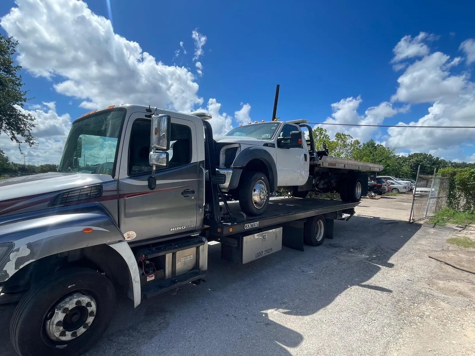 Heavy truck cab on large flatbed tow truck in Houston TX